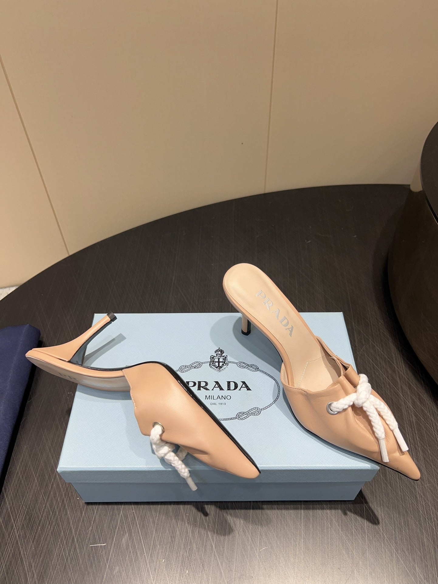 PRADA 25S BRAIDED DETAIL MULES 85MM IN BEIGE CALFSKIN