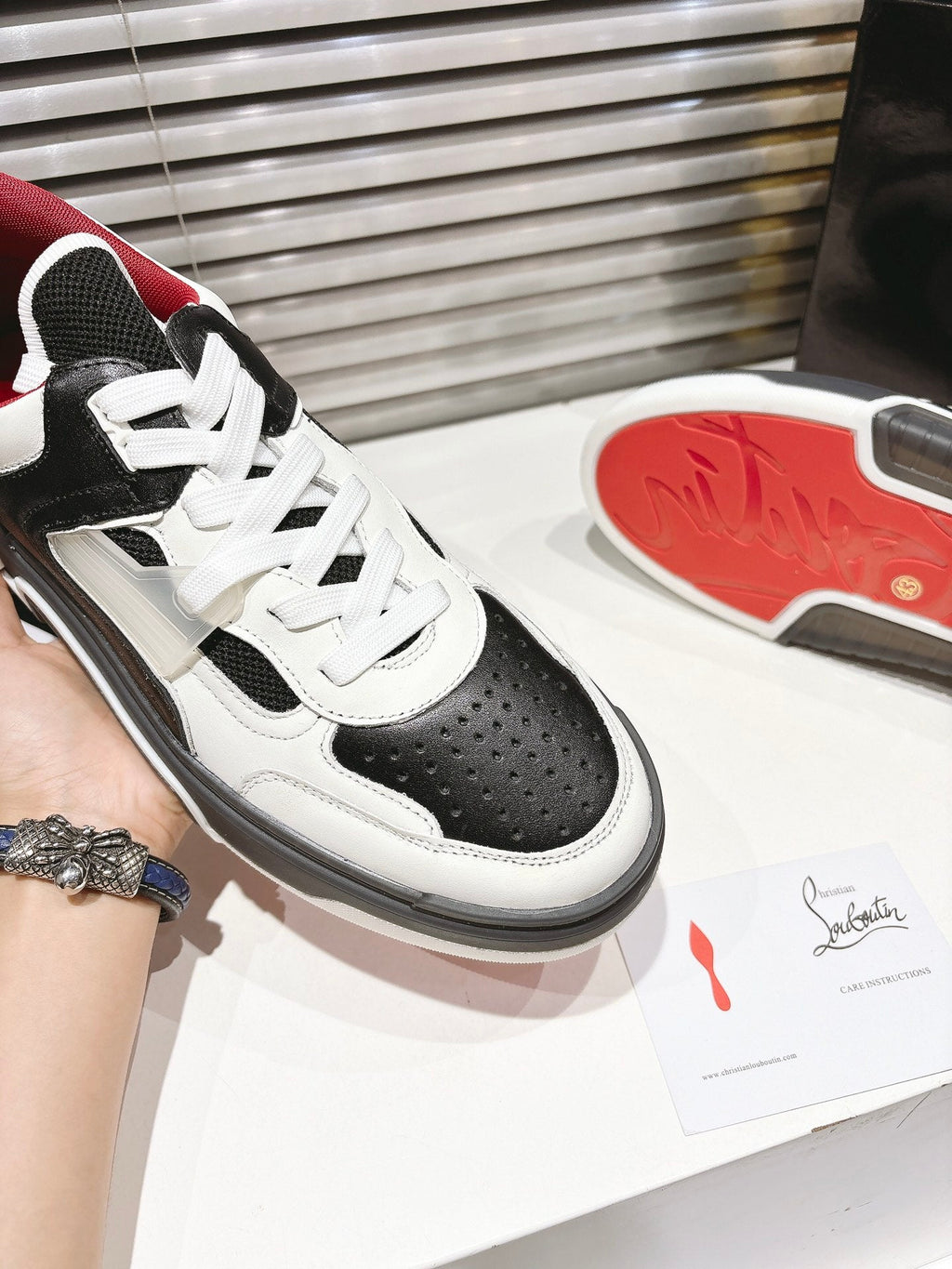 CL SNEAKER IN BLACK AND WHITE CALFSKIN 323158