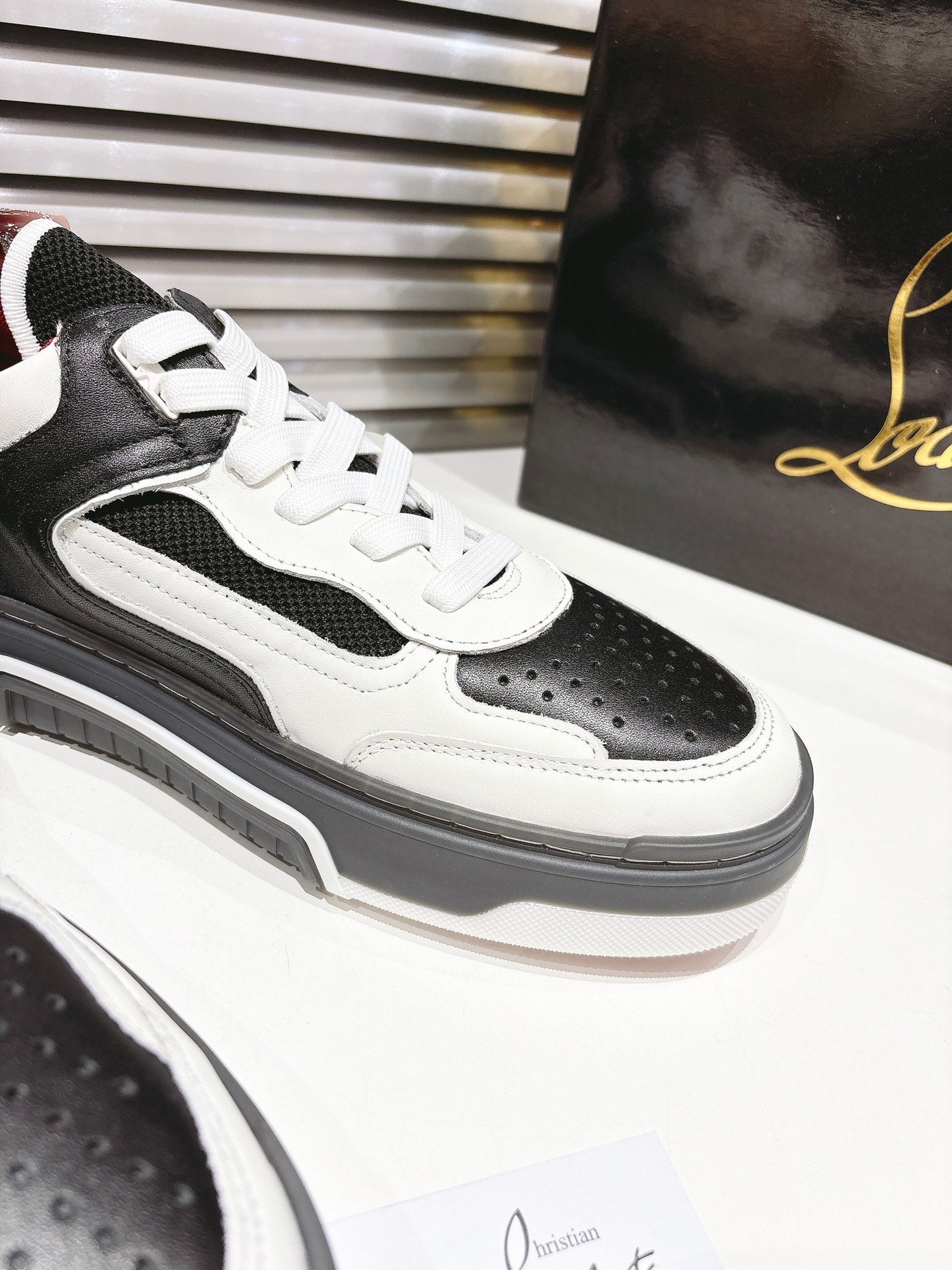 CL SNEAKER IN BLACK AND WHITE CALFSKIN 323158