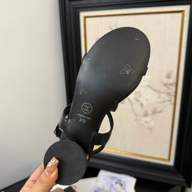 FLAT SANDALS IN BLACK CALFSKIN WITH BOW