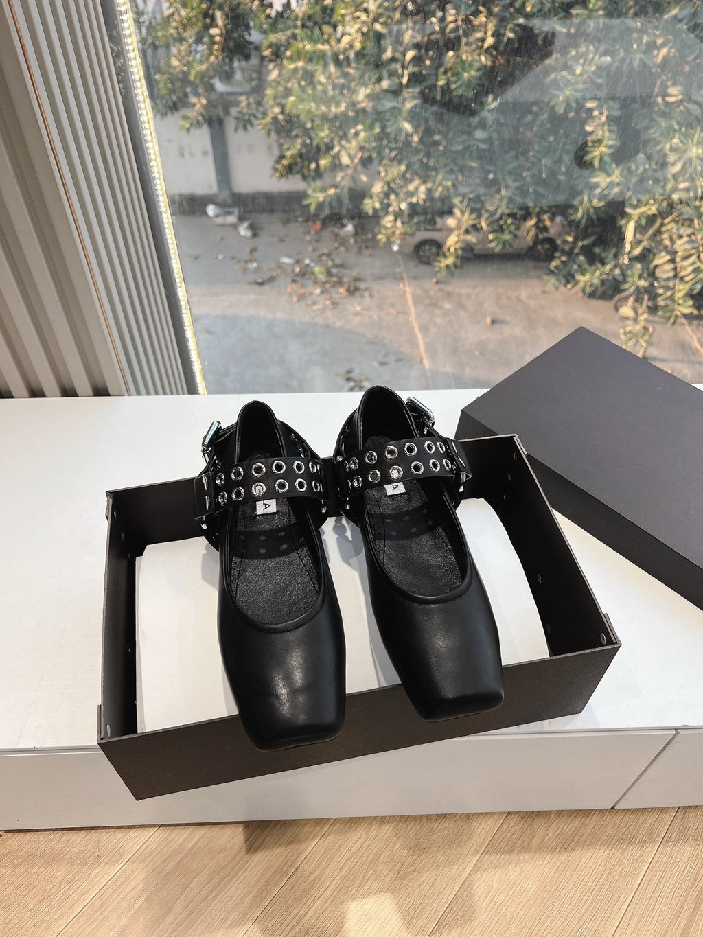 ALAIA 26S FLATS IN BLACK CALFSKIN WITH SILVER STUD STRAP