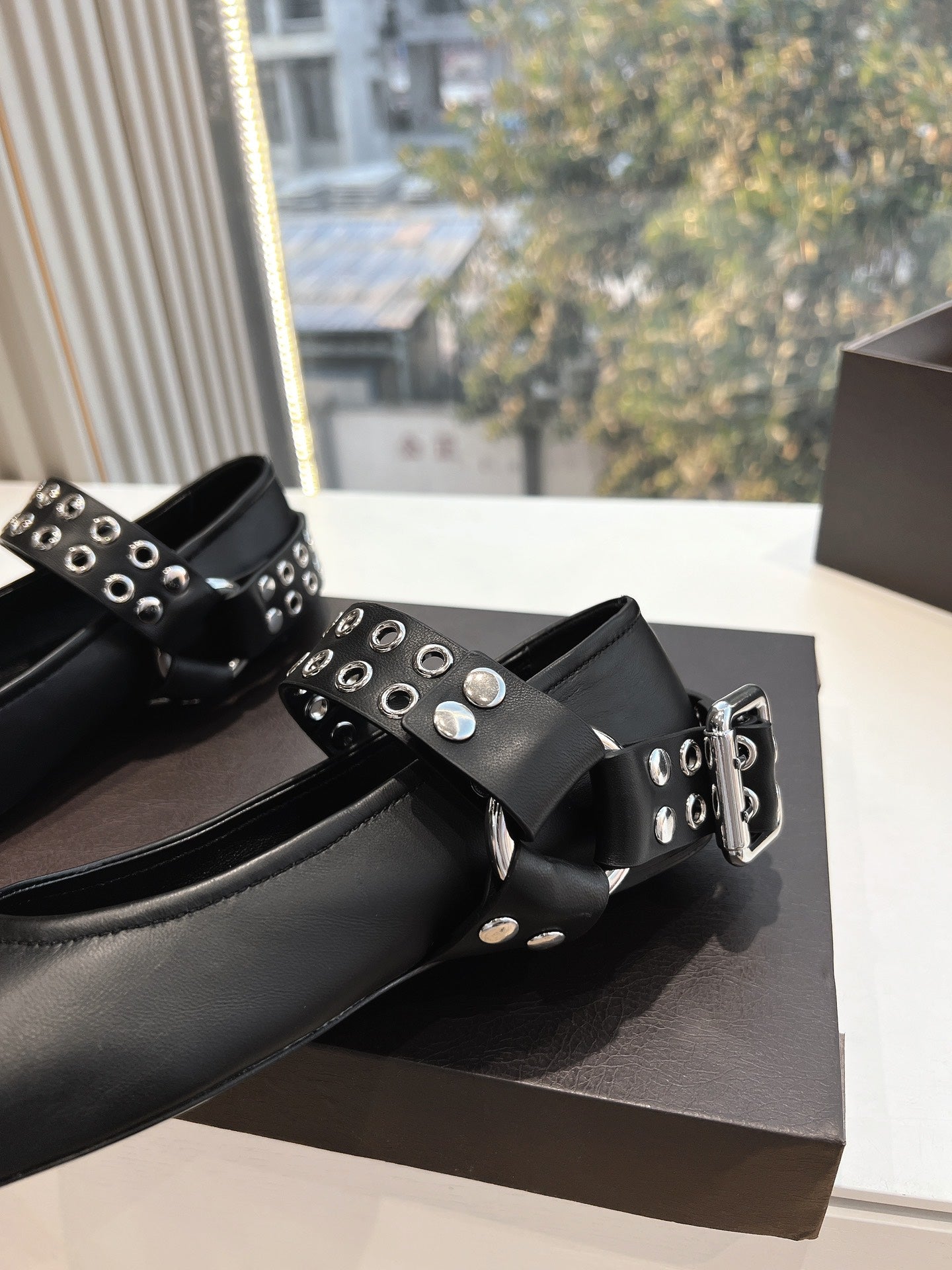 ALAIA 26S FLATS IN BLACK CALFSKIN WITH SILVER STUD STRAP