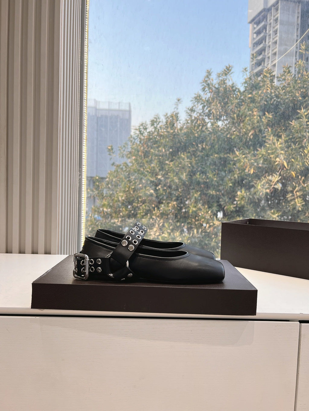ALAIA 26S FLATS IN BLACK CALFSKIN WITH SILVER STUD STRAP