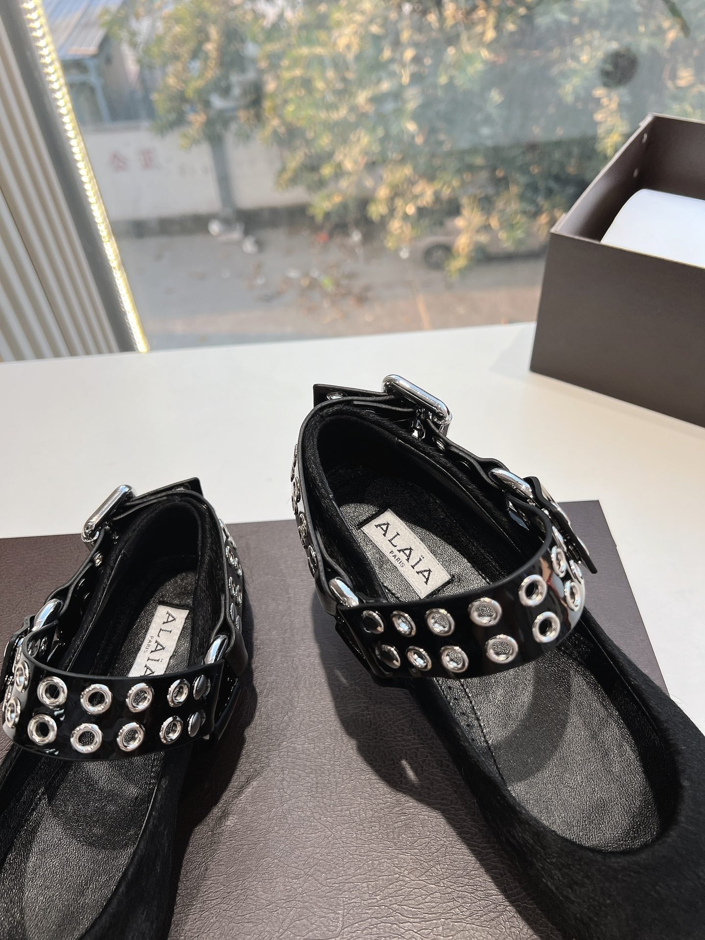 ALAIA 26S FLATS IN BLACK PONY HAIR WITH SILVER STUD STRAP