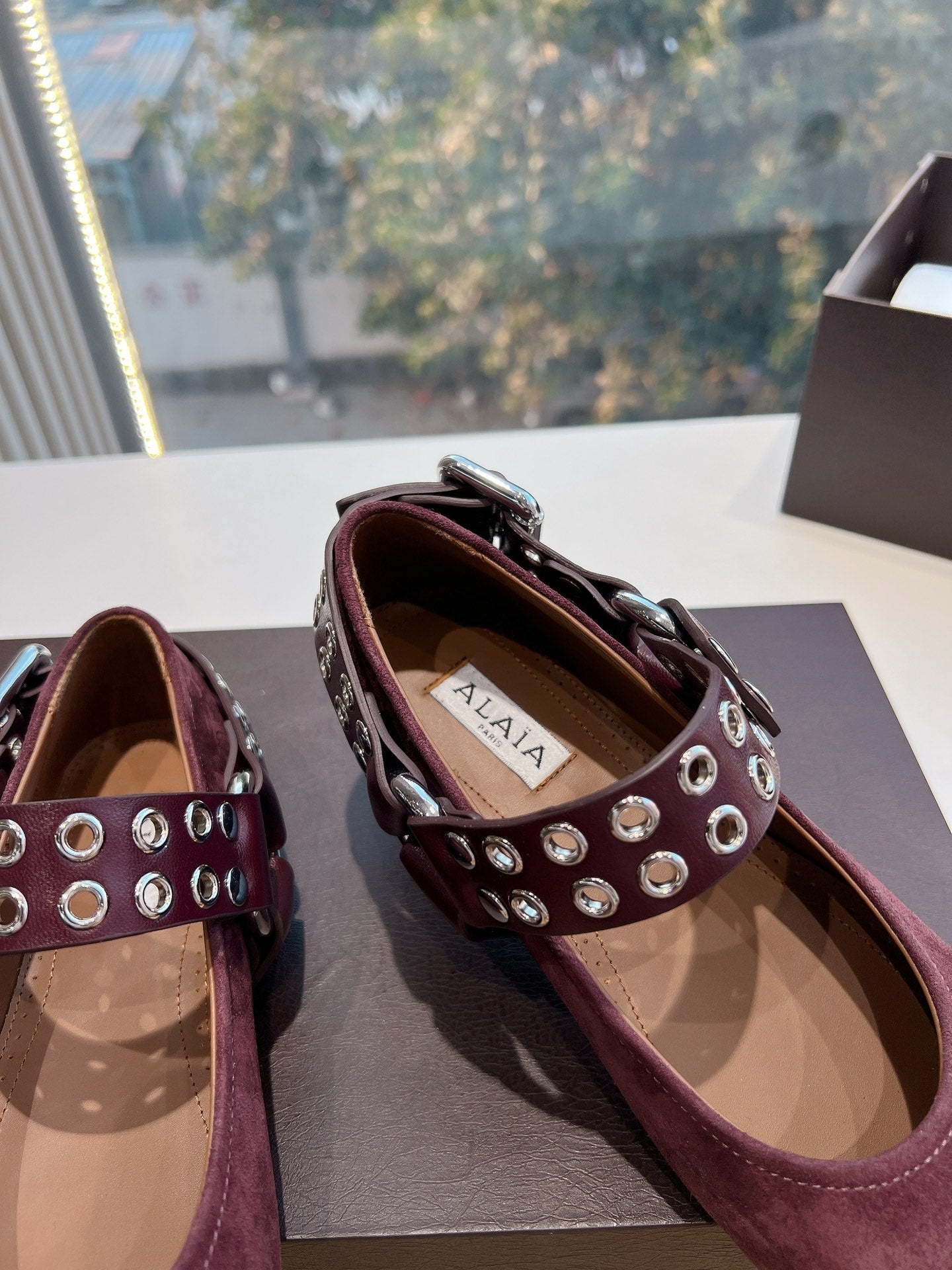 ALAIA 26S FLATS IN DARK RED SUEDE WITH SILVER STUD STRAP