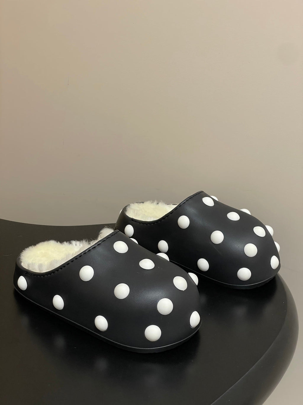 BALENCIAGA 25S FUR-LINED MULES IN BLACK AND WHITE FAUX LEATHER