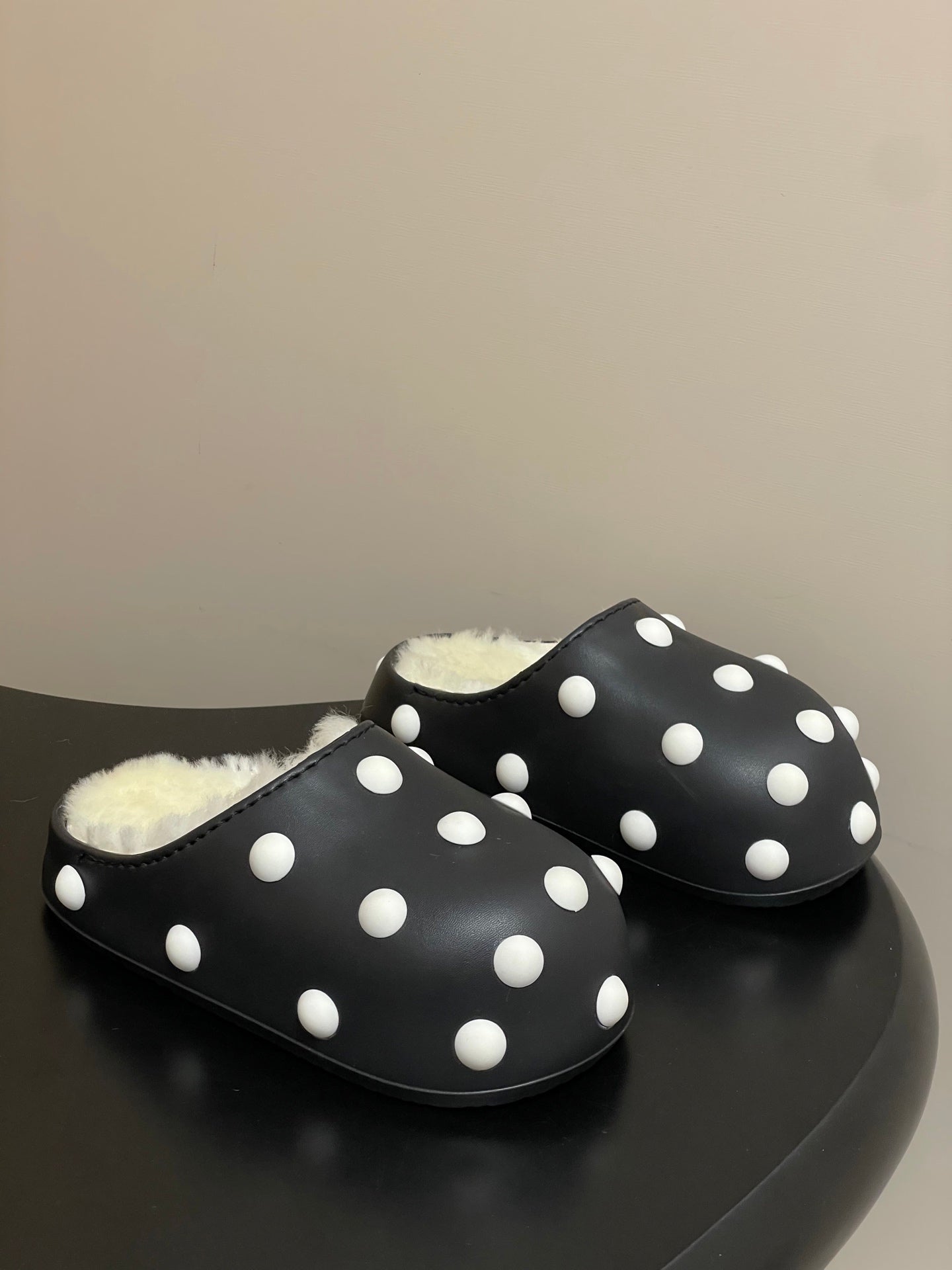BALENCIAGA 25S FUR-LINED MULES IN BLACK AND WHITE FAUX LEATHER