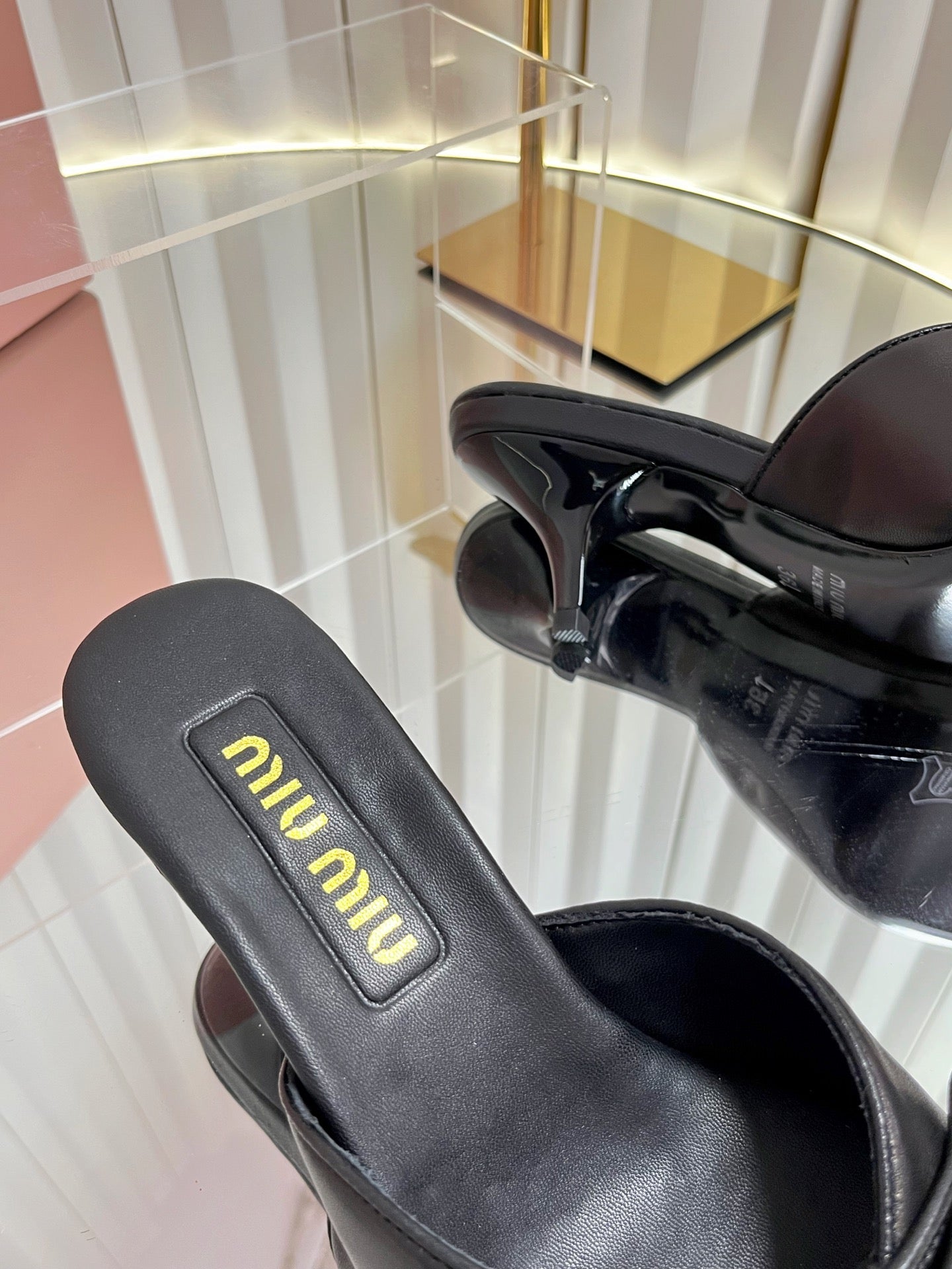 MIUMIU 26S MULE SANDALS 55MM IN BLACK CALFSKIN WITH BOW