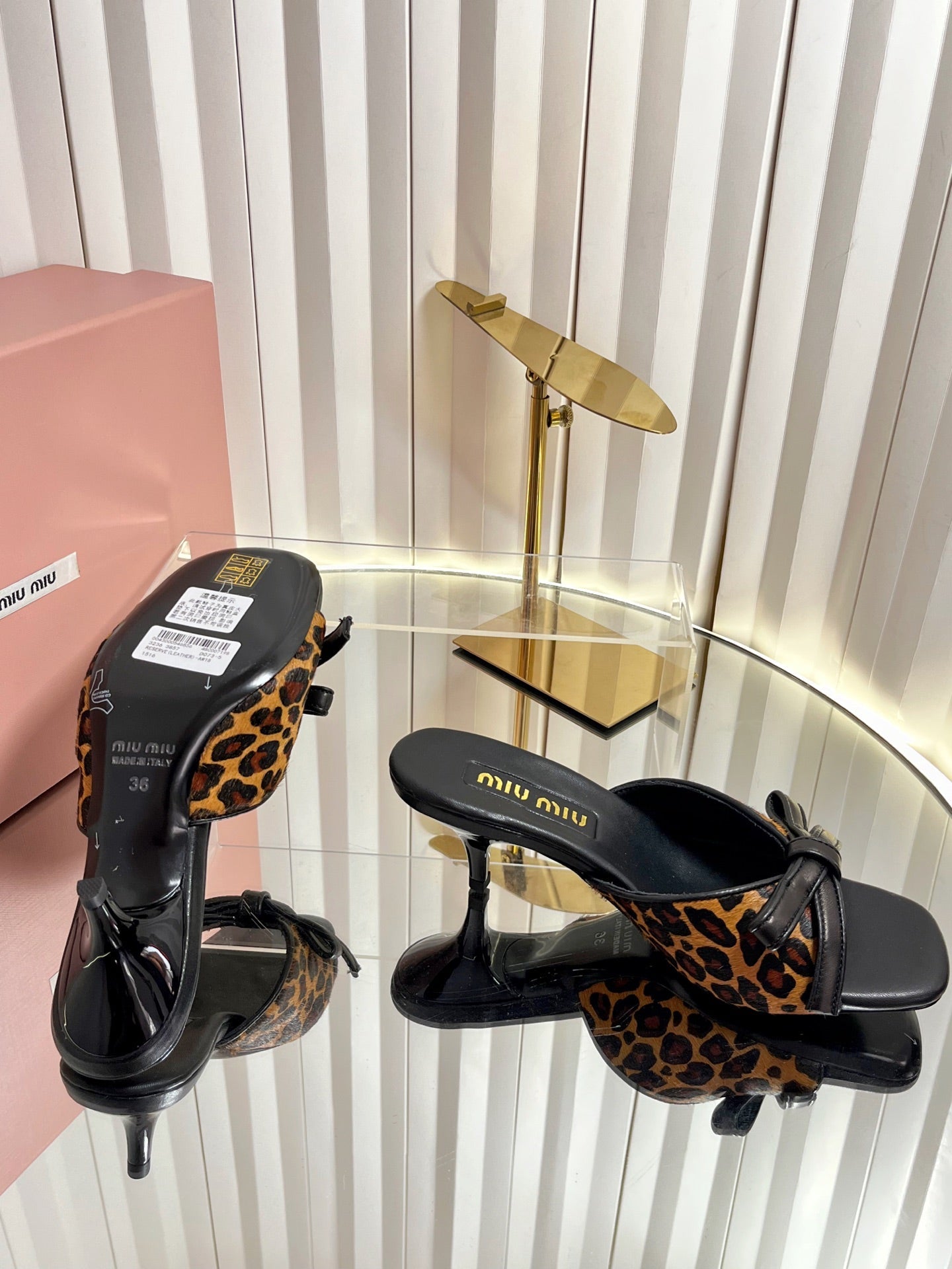 MIUMIU 26S MULE SANDALS 55MM IN LEOPARD PRINT CALF HAIR WITH BOW
