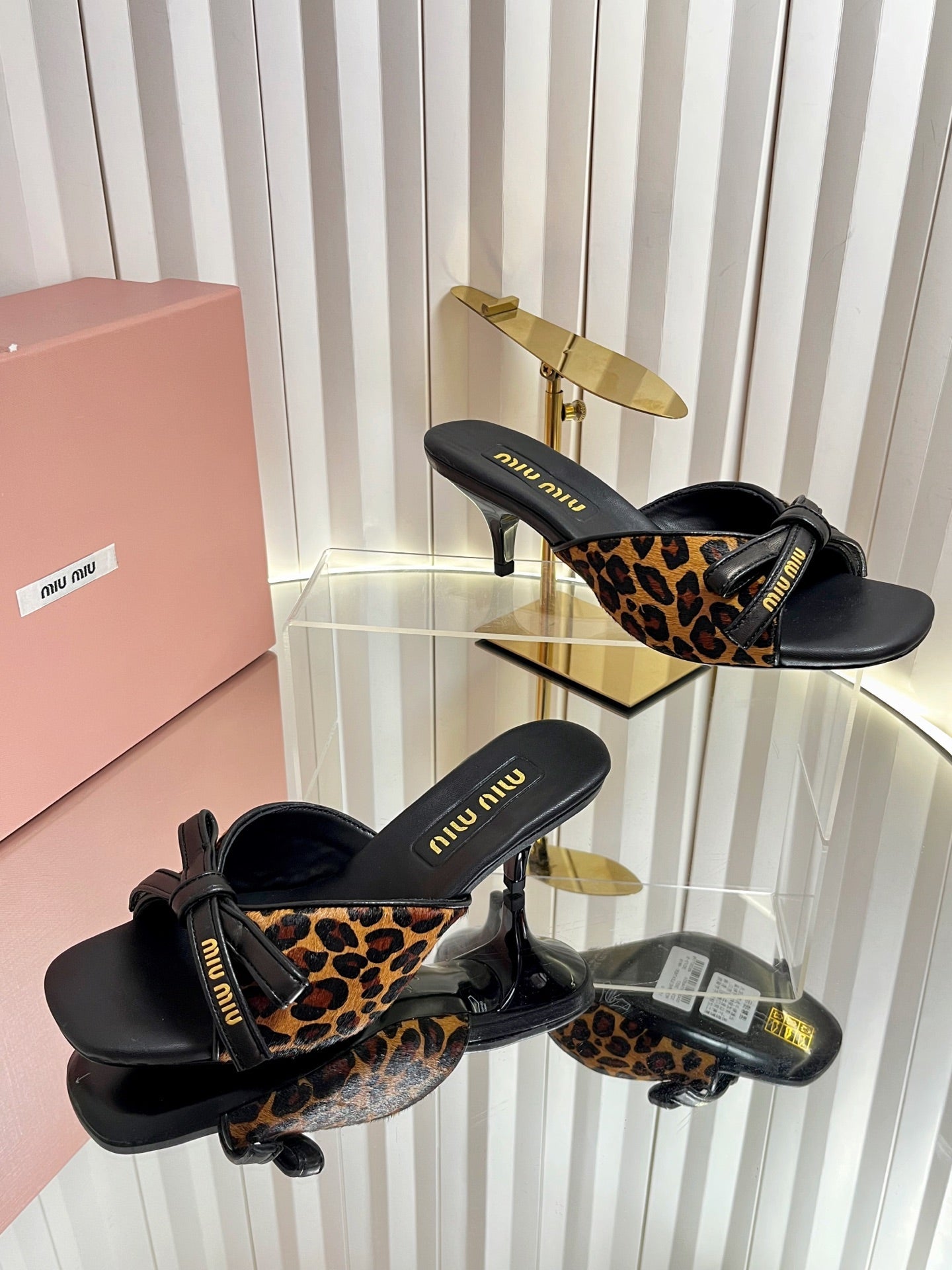 MIUMIU 26S MULE SANDALS 55MM IN LEOPARD PRINT CALF HAIR WITH BOW