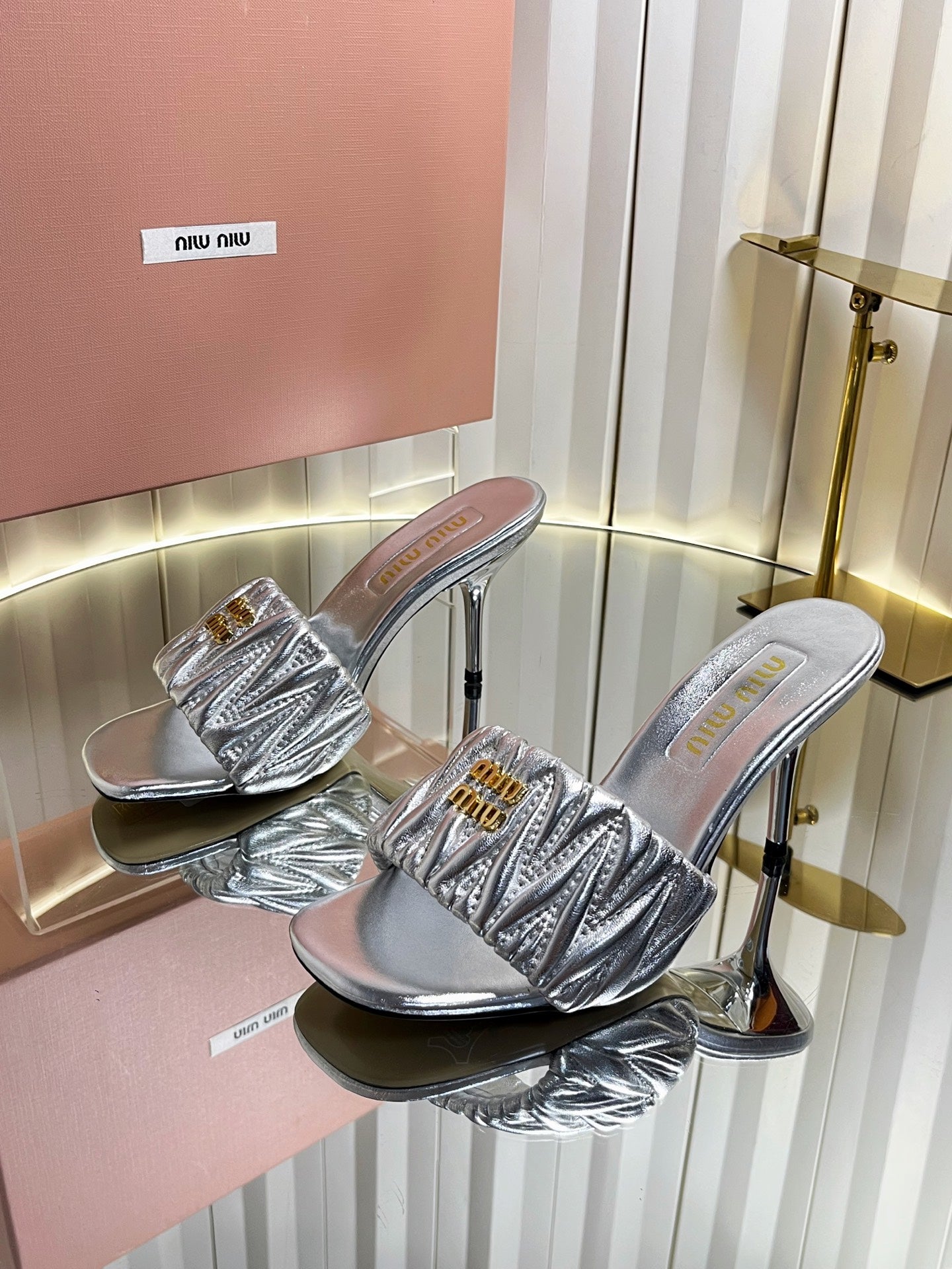 MIUMIU 26S HIGH-HEEL MULE SANDALS 85MM IN SILVER CALFSKIN GOLD HARDWARE