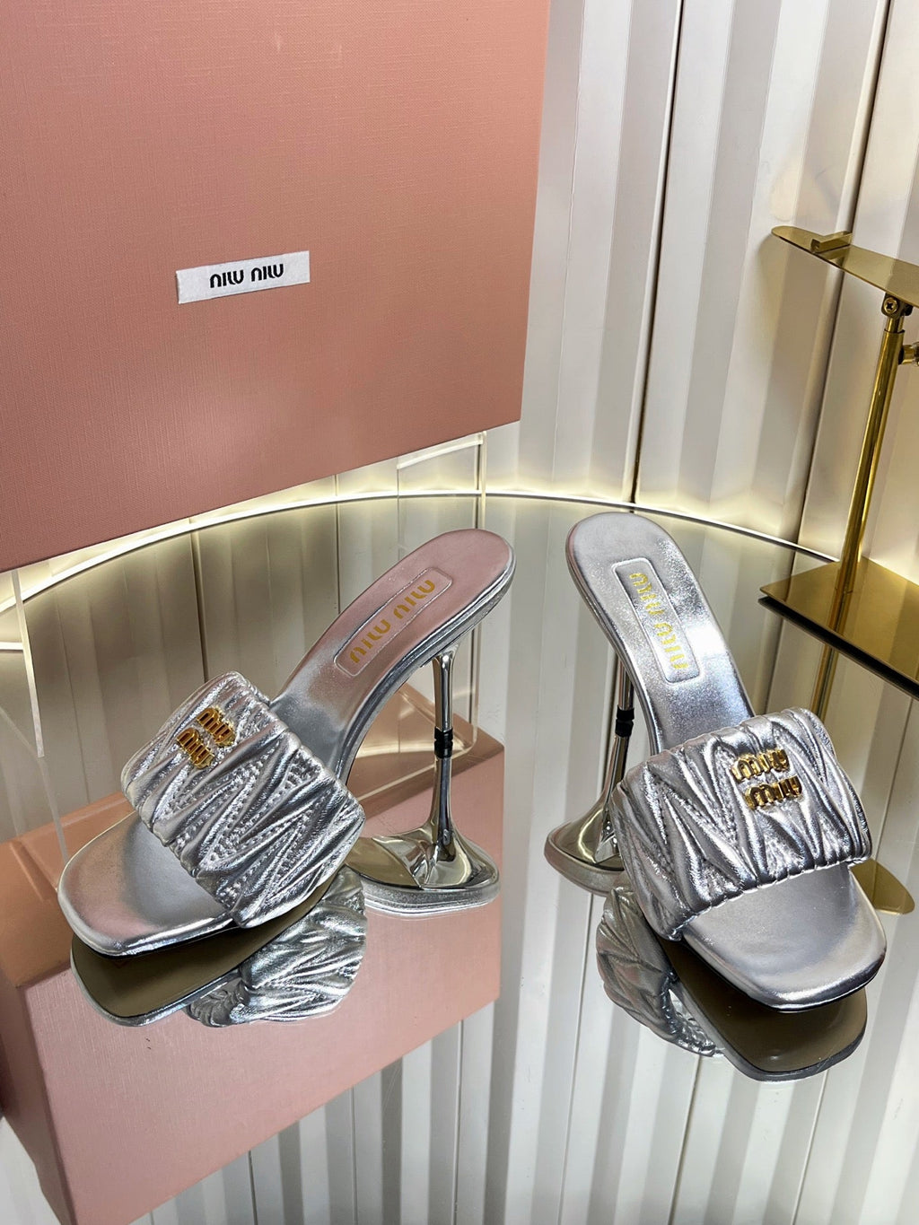 MIUMIU 26S HIGH-HEEL MULE SANDALS 85MM IN SILVER CALFSKIN GOLD HARDWARE