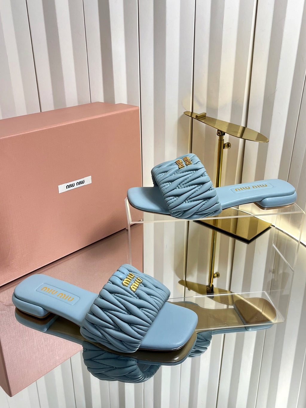 MIUMIU 26S MATELASSE SLIDES IN LIGHT BLUE CALFSKIN GOLD HARDWARE