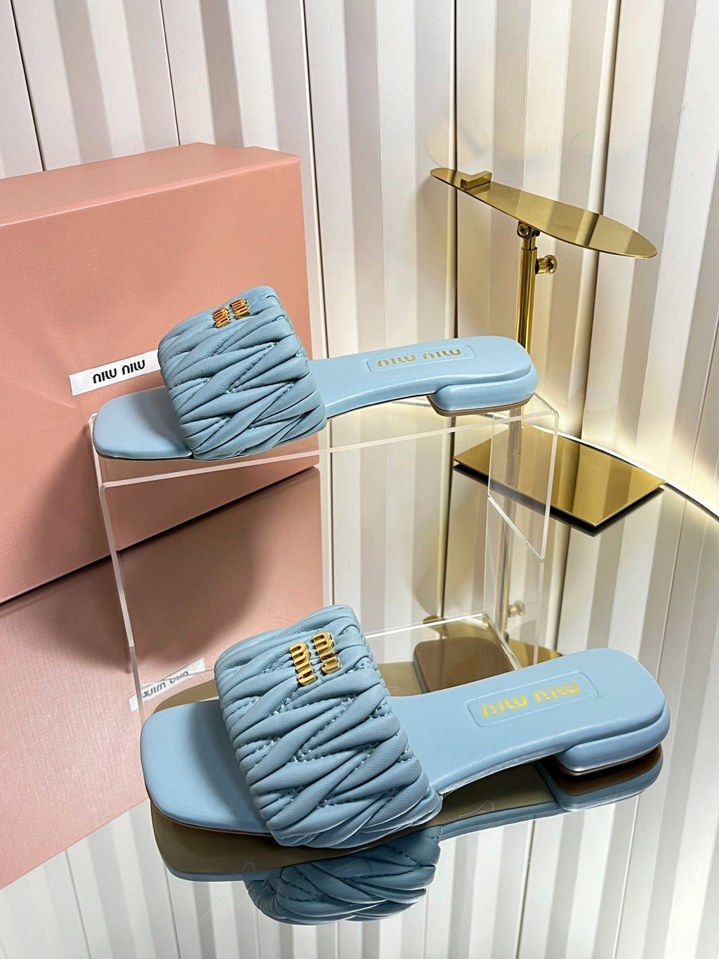 MIUMIU 26S MATELASSE SLIDES IN LIGHT BLUE CALFSKIN GOLD HARDWARE