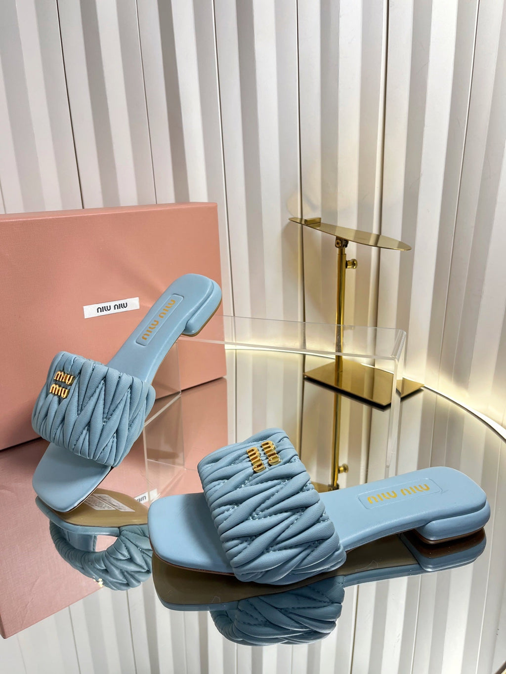 MIUMIU 26S MATELASSE SLIDES IN LIGHT BLUE CALFSKIN GOLD HARDWARE