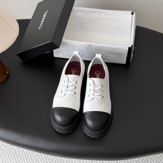 CHANEL 26S LACE UP PLATFORM IN BLACK AND WHITE CALFSKIN