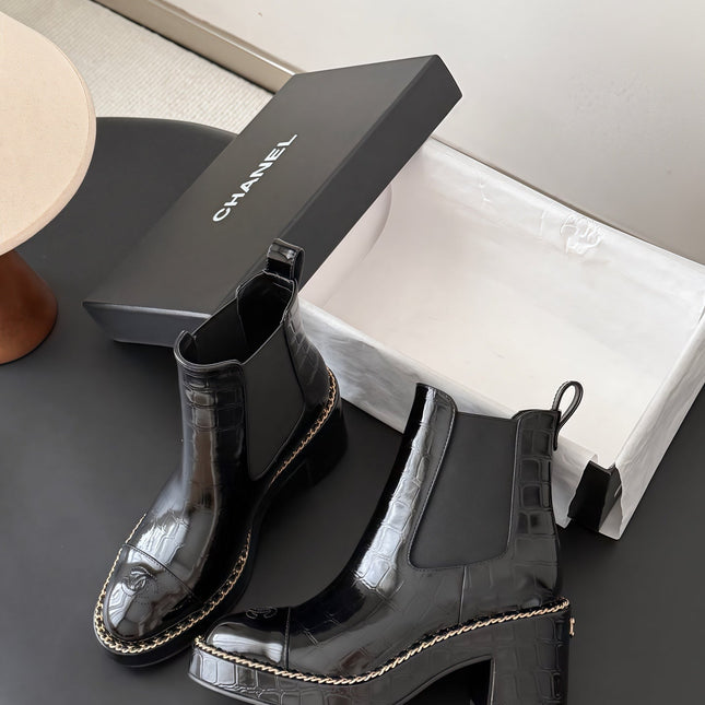 CHANEL 26S CHELSEA ANKLE BOOTS 70 MM IN BLACK EMBOSSED AND PATENT