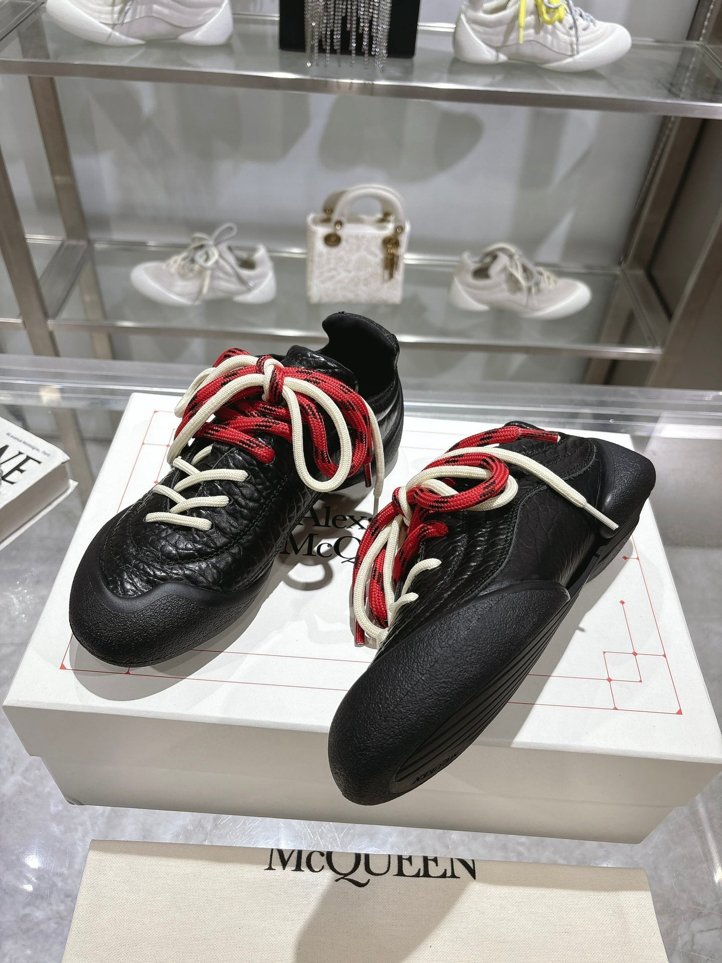FLEXION SNEAKER IN BLACK CALFSKIN WITH RED AND WHITE LACES