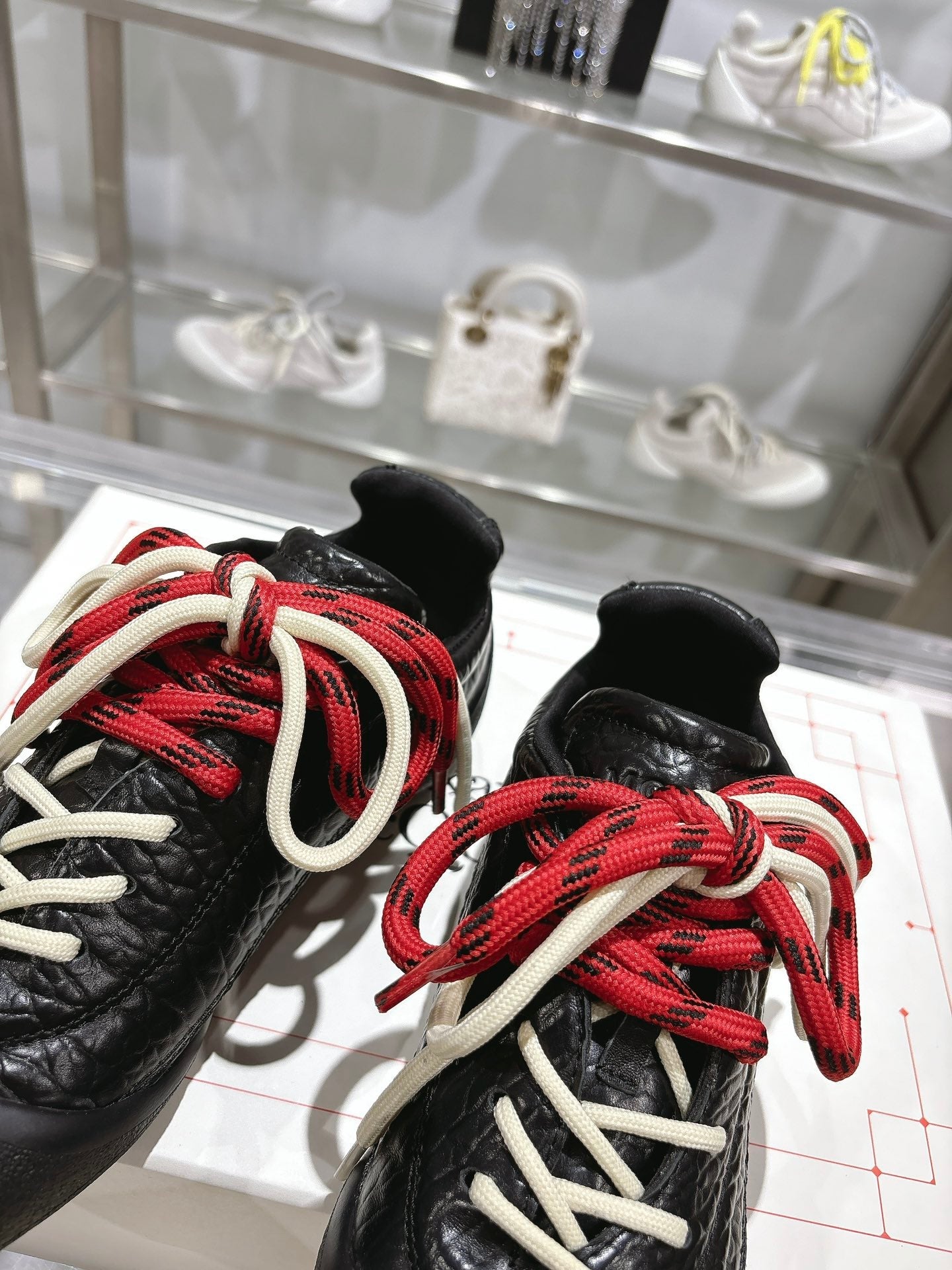 FLEXION SNEAKER IN BLACK CALFSKIN WITH RED AND WHITE LACES