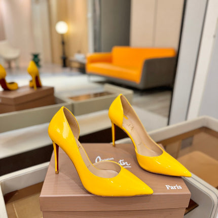 CHRISTIAN LOUBOUTIN 26S CUTOUT SIDE PUMP HEELS 105 MM IN YELLOW PATENT CALFSKIN