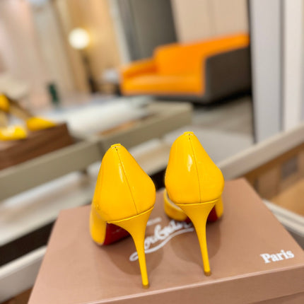 CHRISTIAN LOUBOUTIN 26S CUTOUT SIDE PUMP HEELS 105 MM IN YELLOW PATENT CALFSKIN