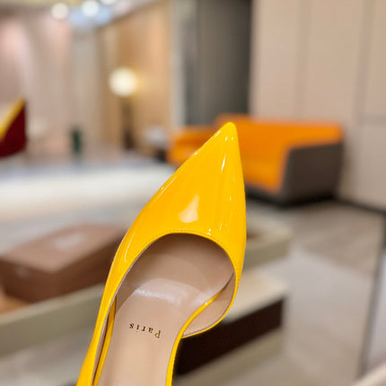 CHRISTIAN LOUBOUTIN 26S CUTOUT SIDE PUMP HEELS 105 MM IN YELLOW PATENT CALFSKIN