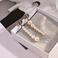 CD 26S PAVE LOGO PEARL DROP EARRINGS IN GOLD TONE METAL 631791