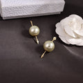 CD 26S DOUBLE PEARL ARROW STUD EARRINGS IN GOLD TONE METAL 631863