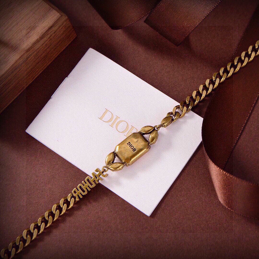 CD 26S DIOR LOGO PINK CRYSTAL CHAIN NECKLACE IN AGED GOLD METAL 633118