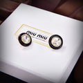 MIUMIU 26S ROUND CRYSTAL STUD EARRINGS IN BLACK RESIN AND GOLD TONE METAL 633262