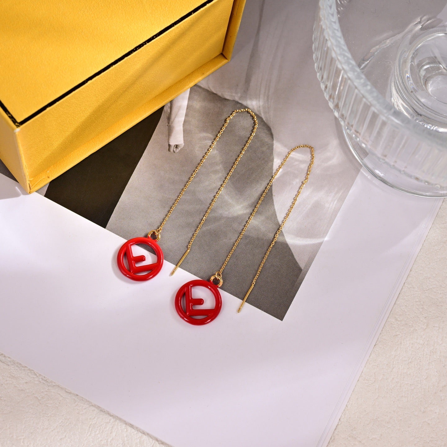 FENDI 26S FF LOGO THREADER EARRINGS IN RED RESIN AND GOLD TONE METAL 634941