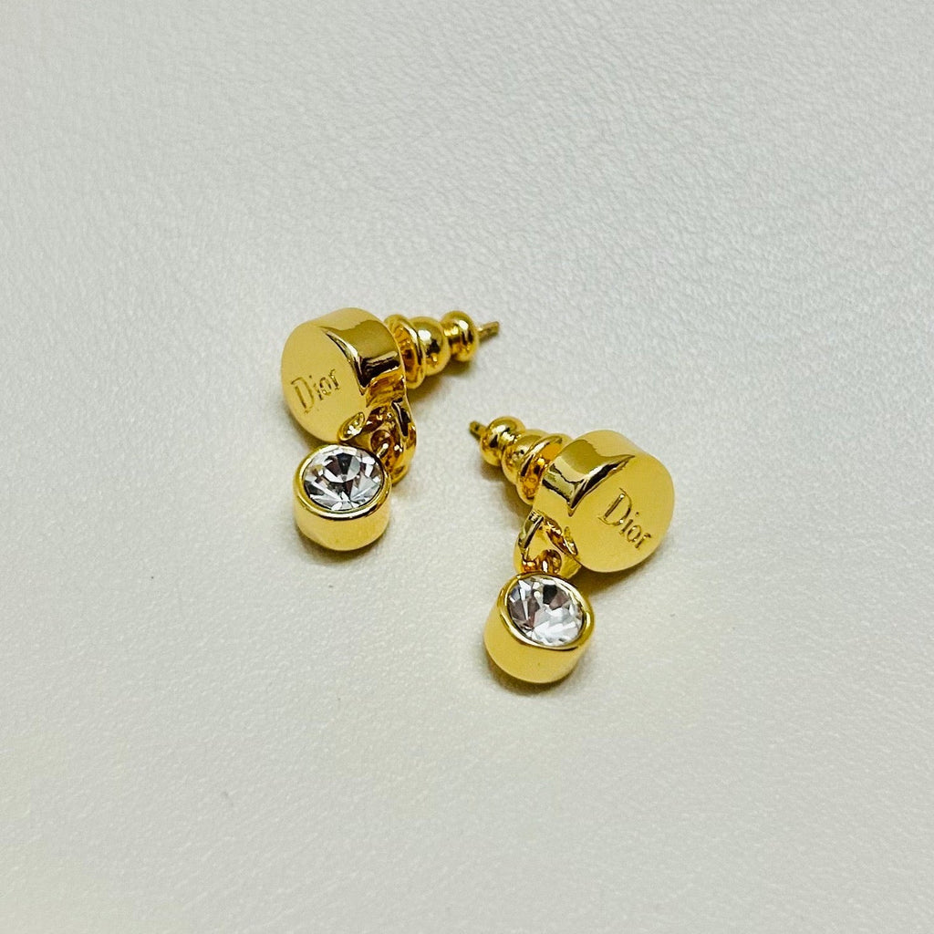 CD 26S CRYSTAL DROP LOGO STUD EARRINGS IN GOLD TONE METAL 646613