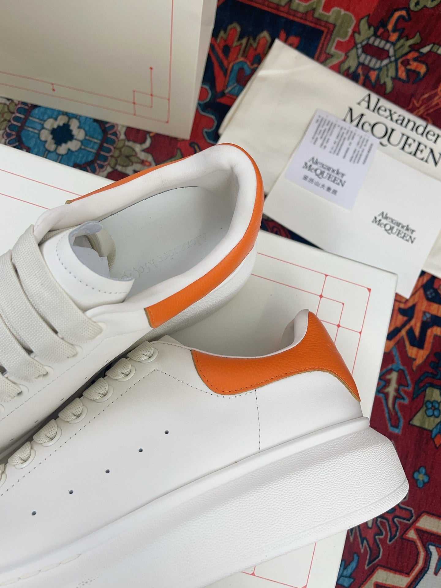 OVERSIZED SNEAKER IN WHITE CALFSKIN ORANGE HEEL TAB EMBOSSED LOGO