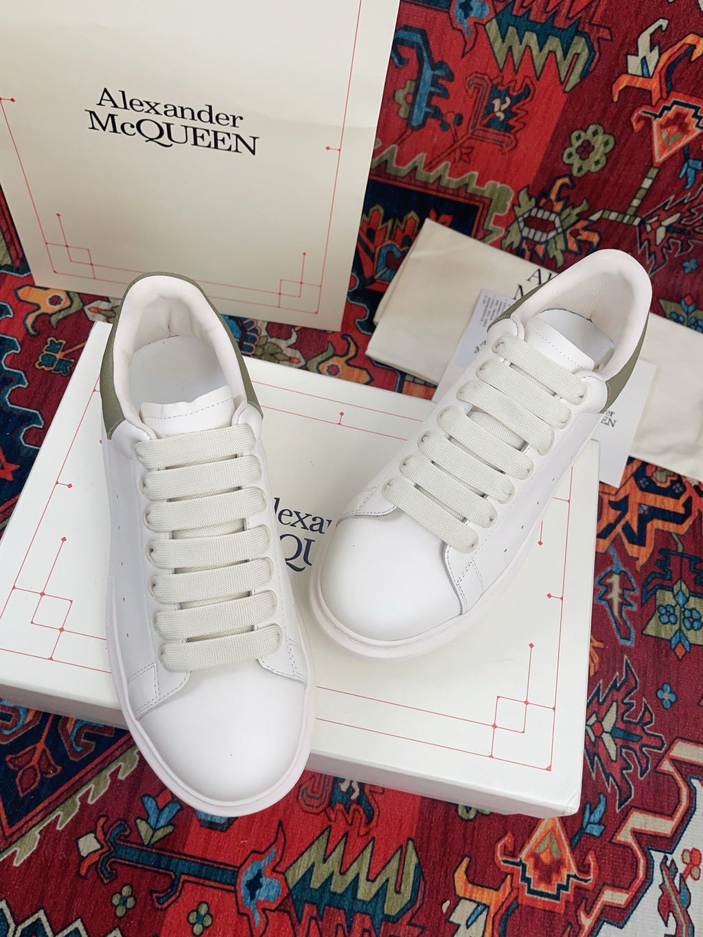 OVERSIZED SNEAKER IN WHITE CALFSKIN WITH EMBOSSED OLIVE GREEN HEEL TAB