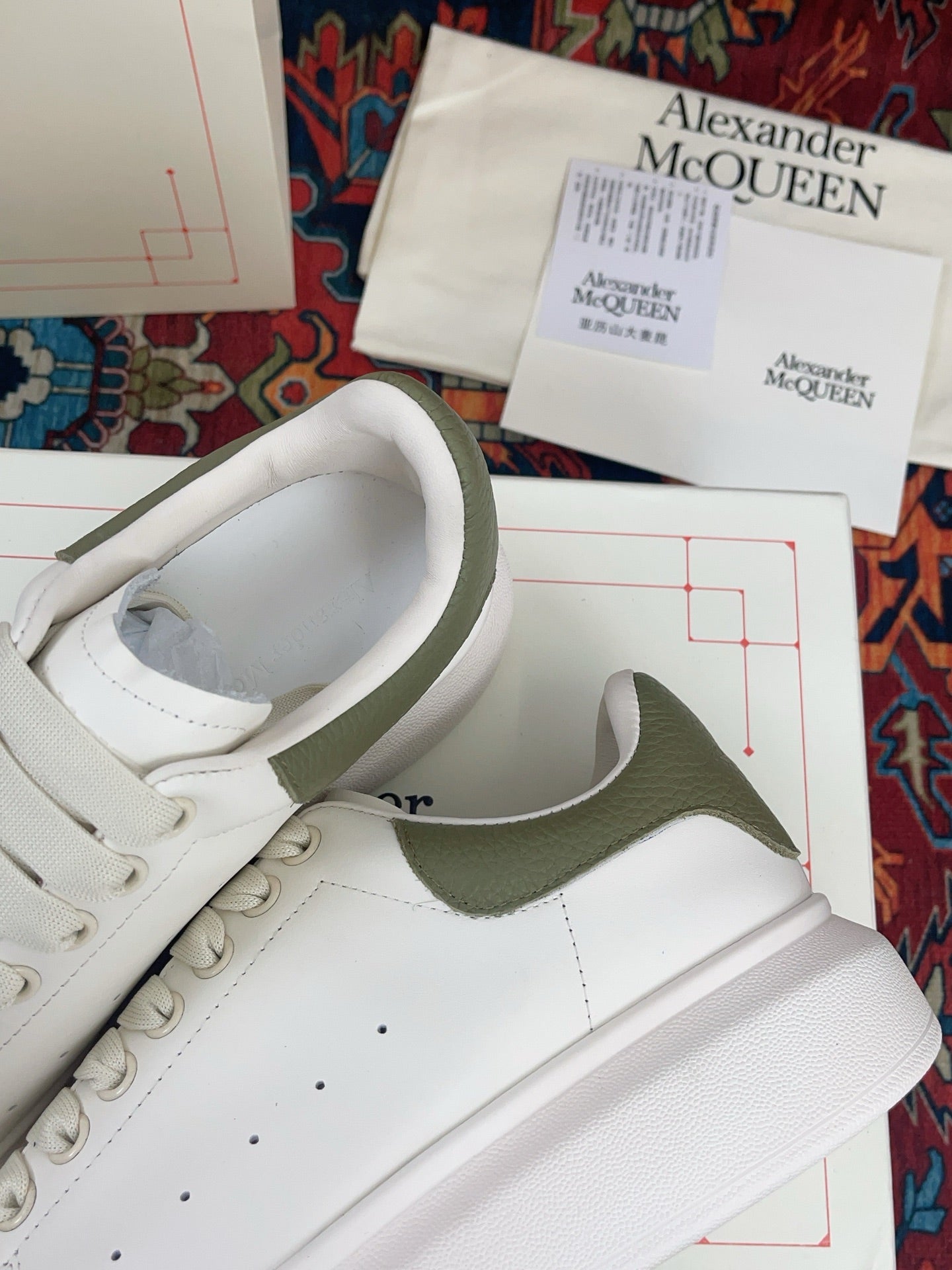 OVERSIZED SNEAKER IN WHITE CALFSKIN WITH EMBOSSED OLIVE GREEN HEEL TAB