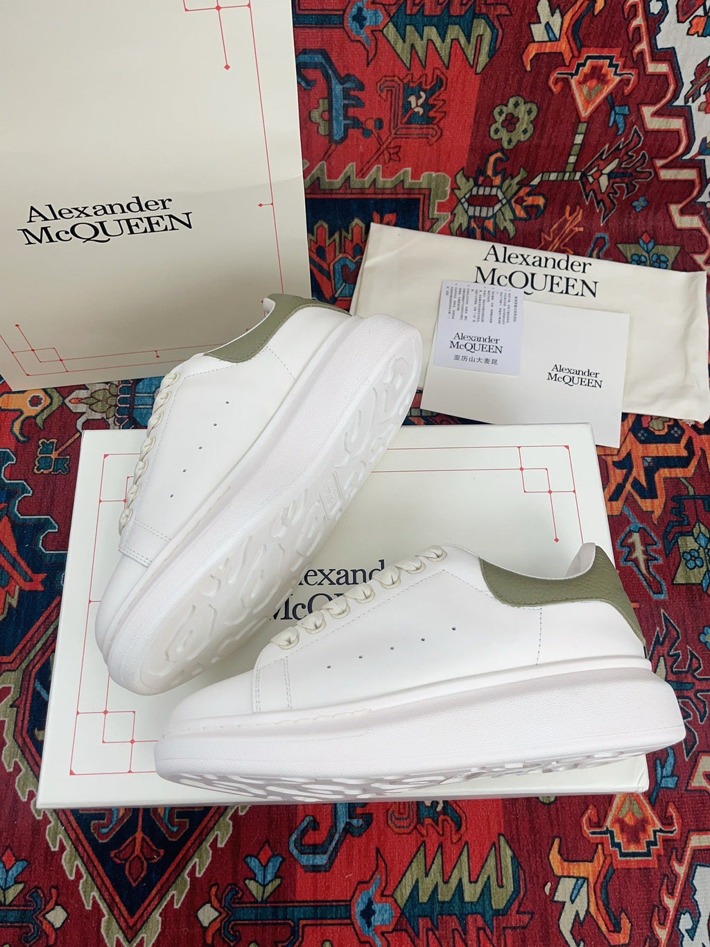 OVERSIZED SNEAKER IN WHITE CALFSKIN WITH EMBOSSED OLIVE GREEN HEEL TAB