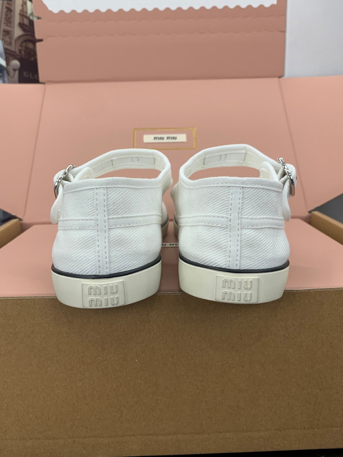MIUMIU 26S MARY JANE FLATS IN WHITE CANVAS LOGO