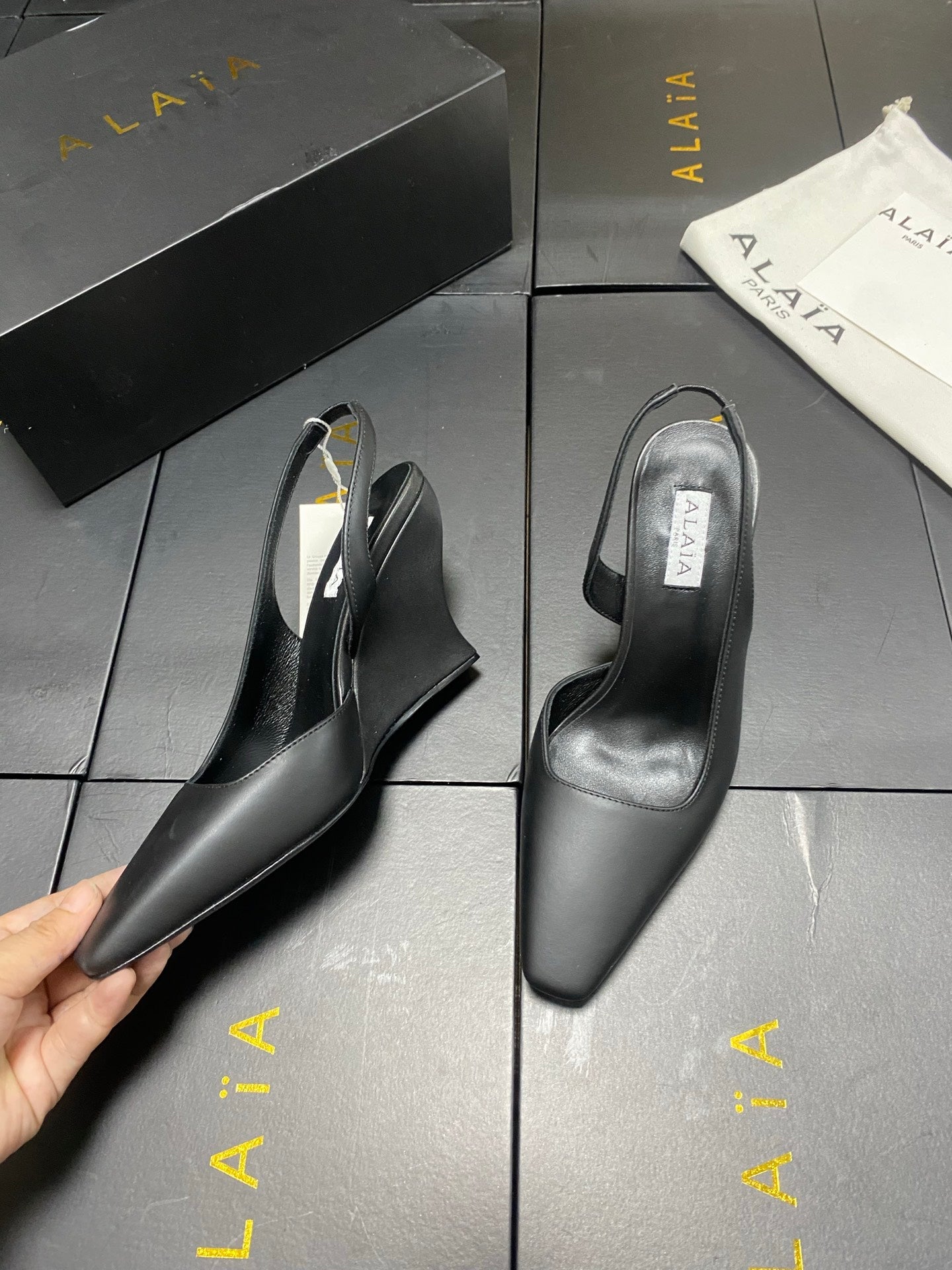 ALAIA 26S WEDGE SLINGBACKS 95 MM IN BLACK CALFSKIN