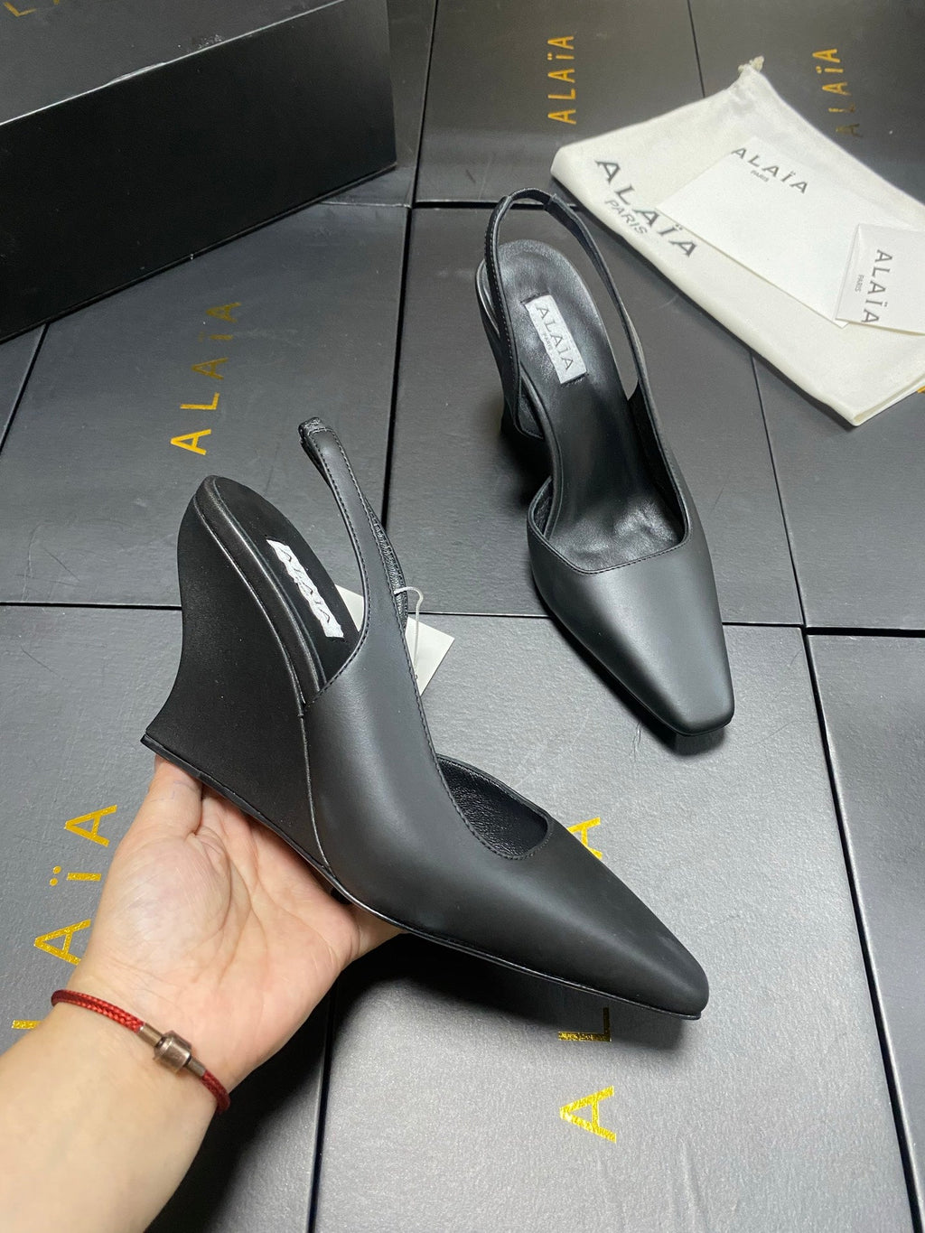ALAIA 26S WEDGE SLINGBACKS 95 MM IN BLACK CALFSKIN
