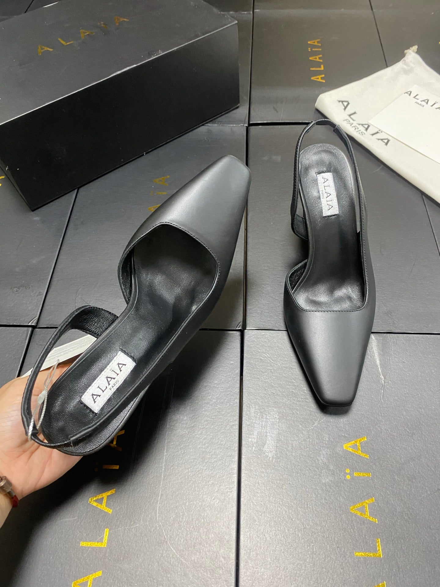 ALAIA 26S WEDGE SLINGBACKS 95 MM IN BLACK CALFSKIN