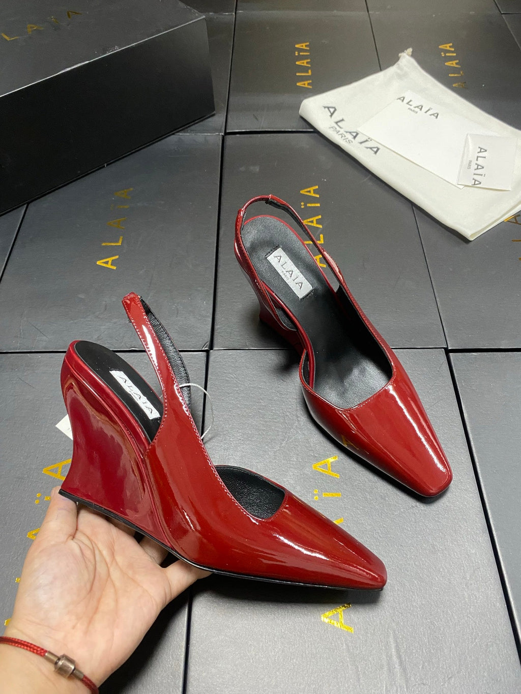 ALAIA 26S WEDGE SLINGBACKS 95 MM IN DARK RED PATENT CALFSKIN