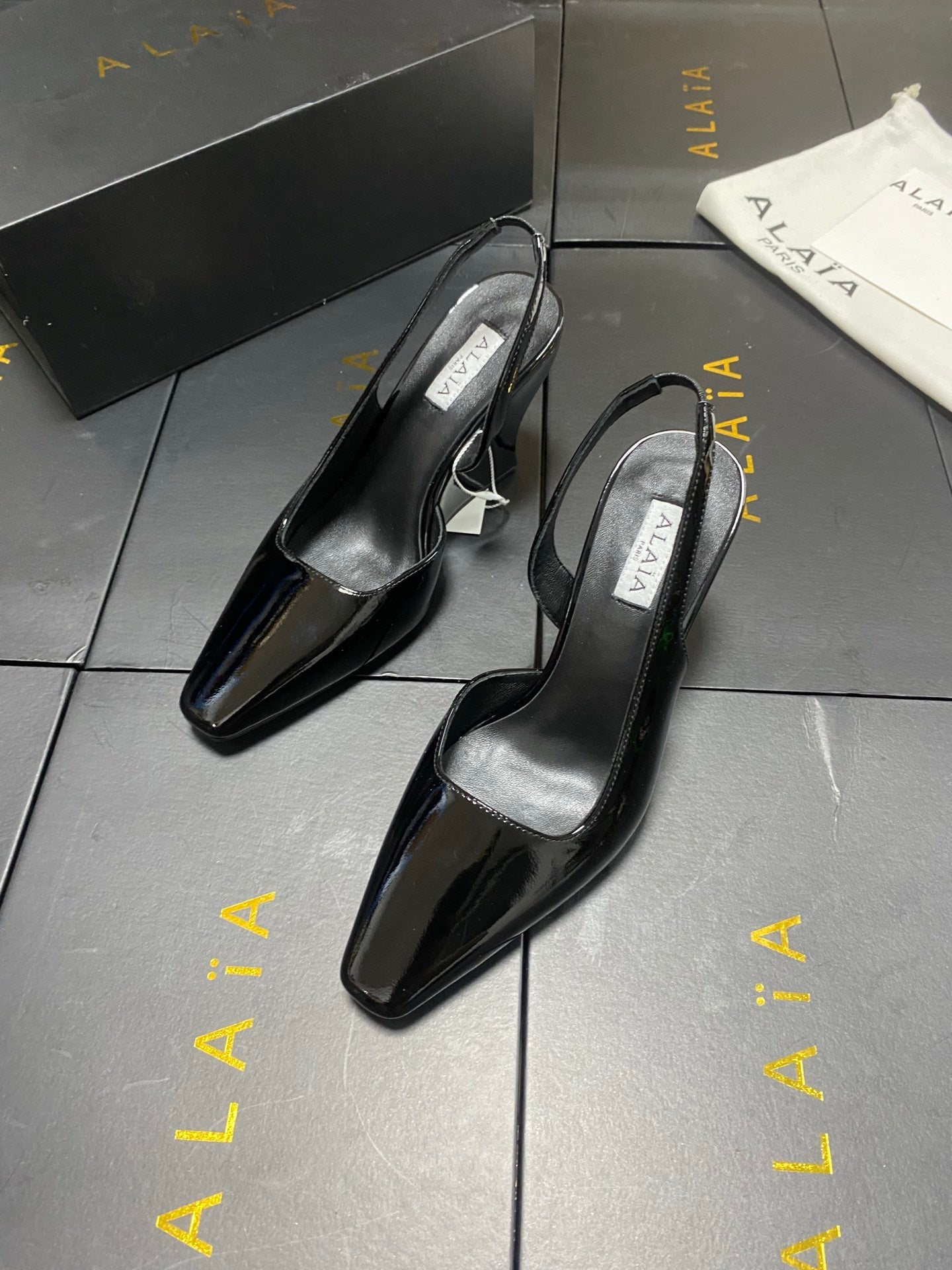 ALAIA 26S WEDGE SLINGBACKS 95 MM IN BLACK PATENT CALFSKIN