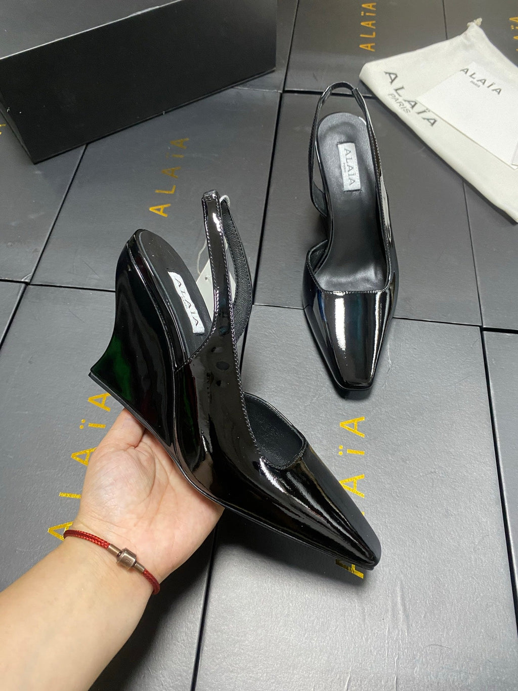 ALAIA 26S WEDGE SLINGBACKS 95 MM IN BLACK PATENT CALFSKIN
