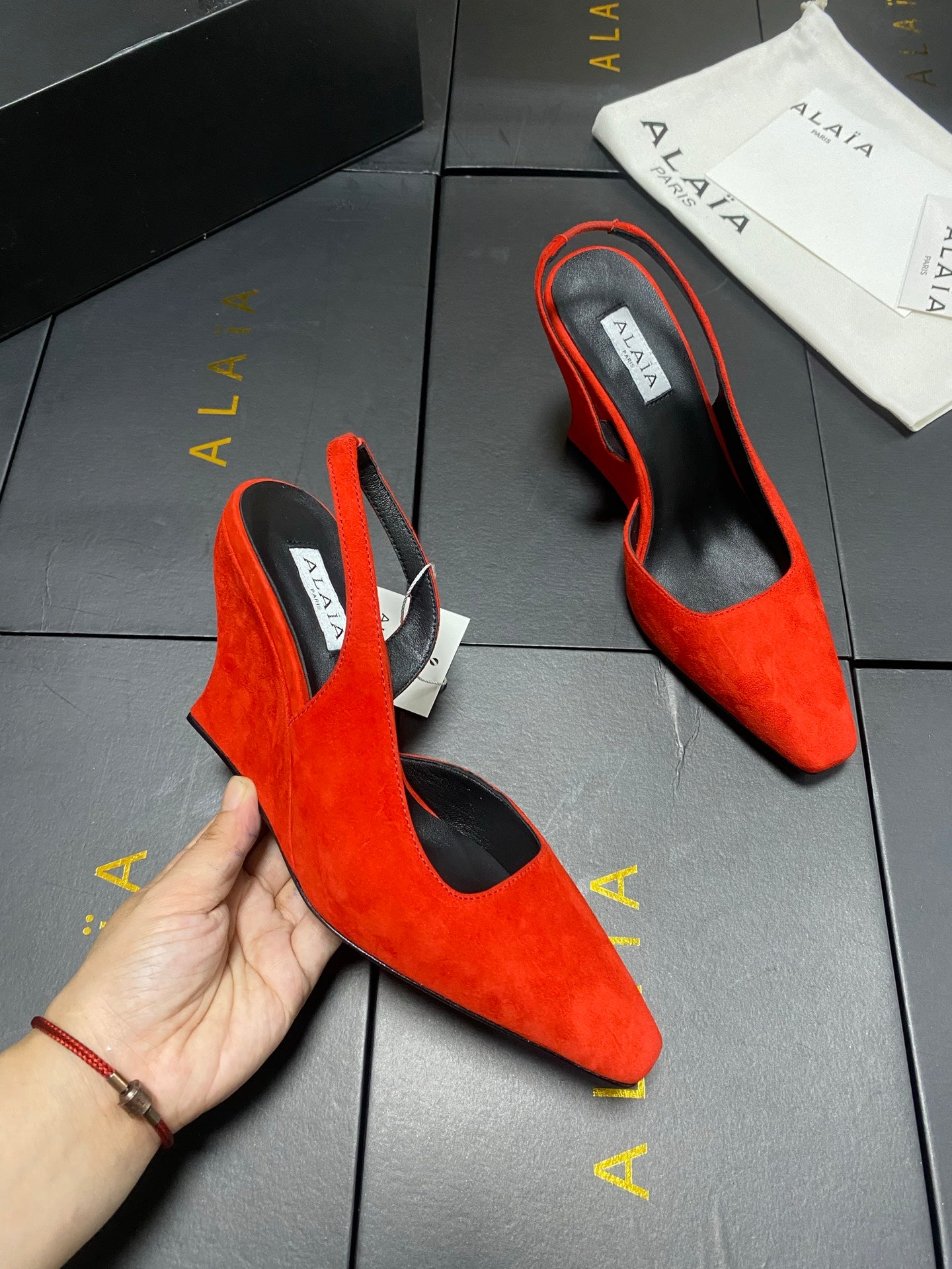 ALAIA 26S WEDGE SLINGBACKS 95 MM IN ORANGE RED SUEDE