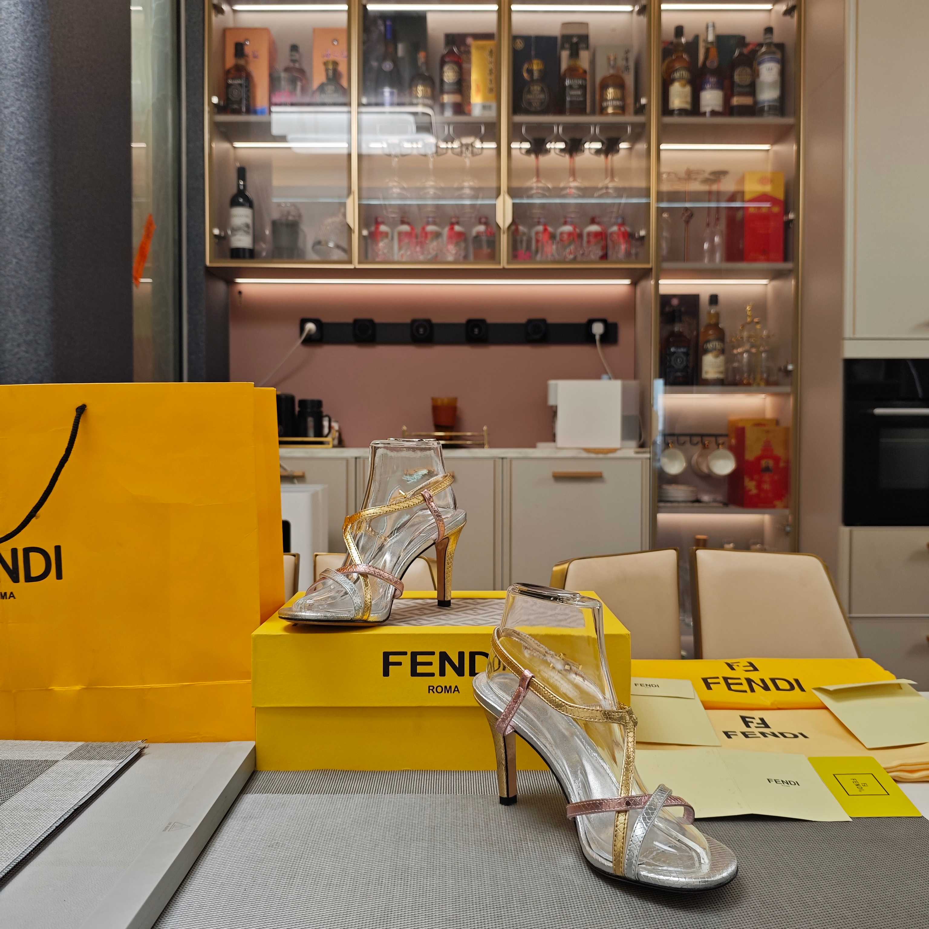 FENDI 26S HIGH-HEELED SANDALS 85 MM IN SILVER AND GOLD CALFSKIN