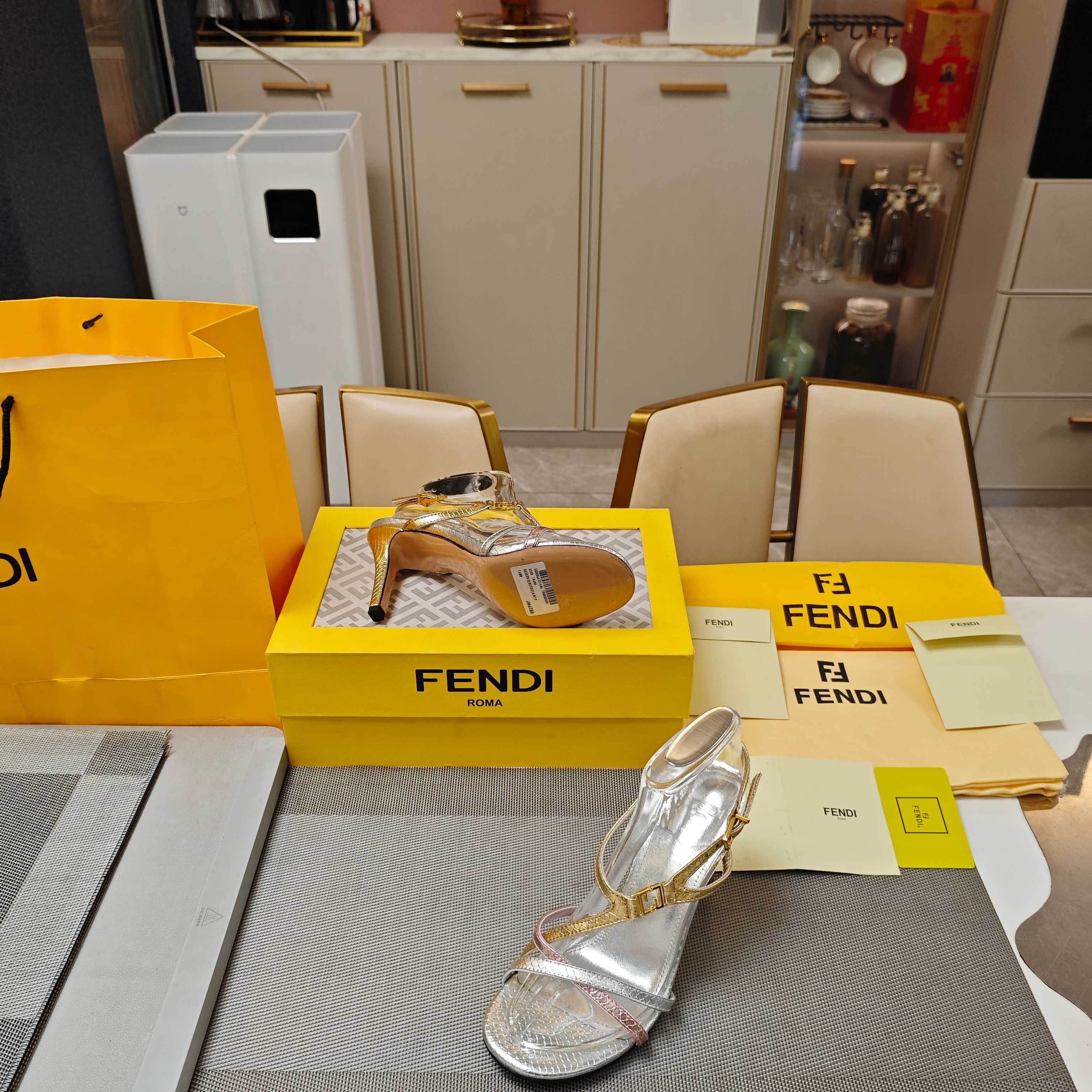 FENDI 26S HIGH-HEELED SANDALS 85 MM IN SILVER AND GOLD CALFSKIN