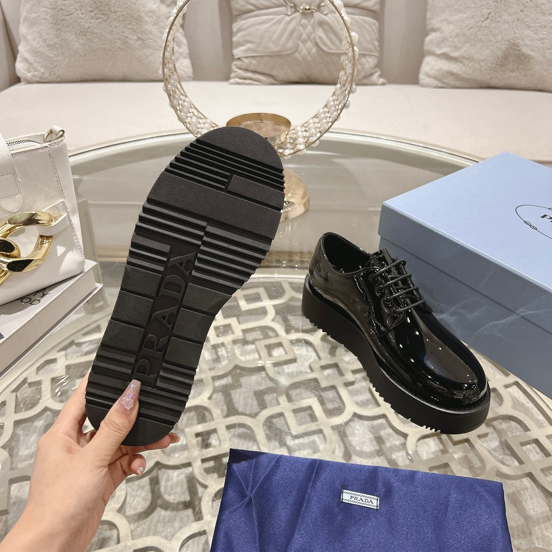 PRADA 26S LOAFERS IN BLACK PATENT CALFSKIN