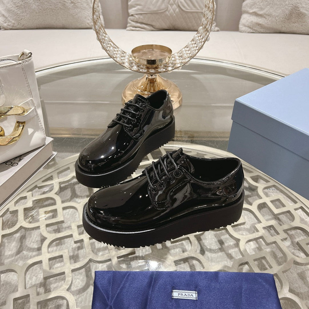 PRADA 26S LOAFERS IN BLACK PATENT CALFSKIN