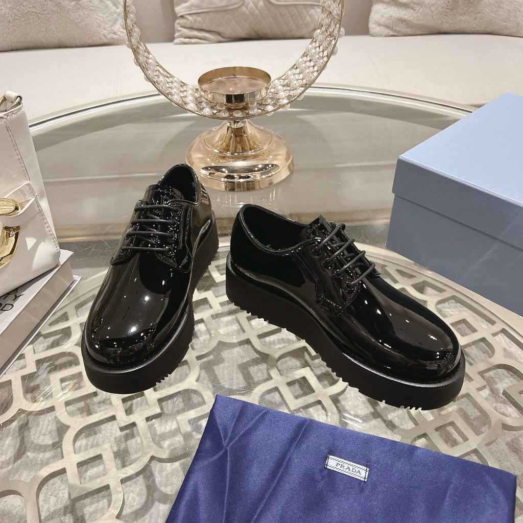 PRADA 26S LOAFERS IN BLACK PATENT CALFSKIN