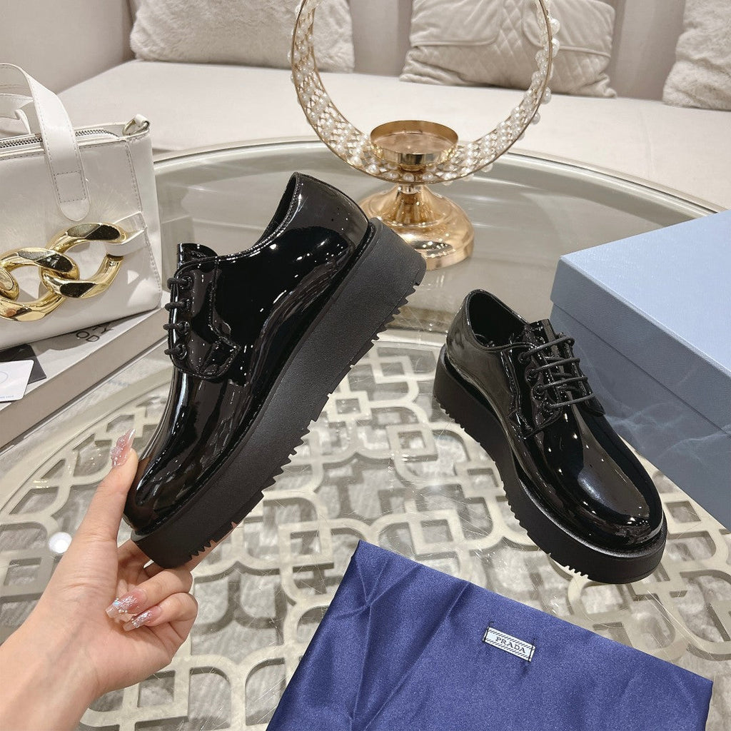 PRADA 26S LOAFERS IN BLACK PATENT CALFSKIN